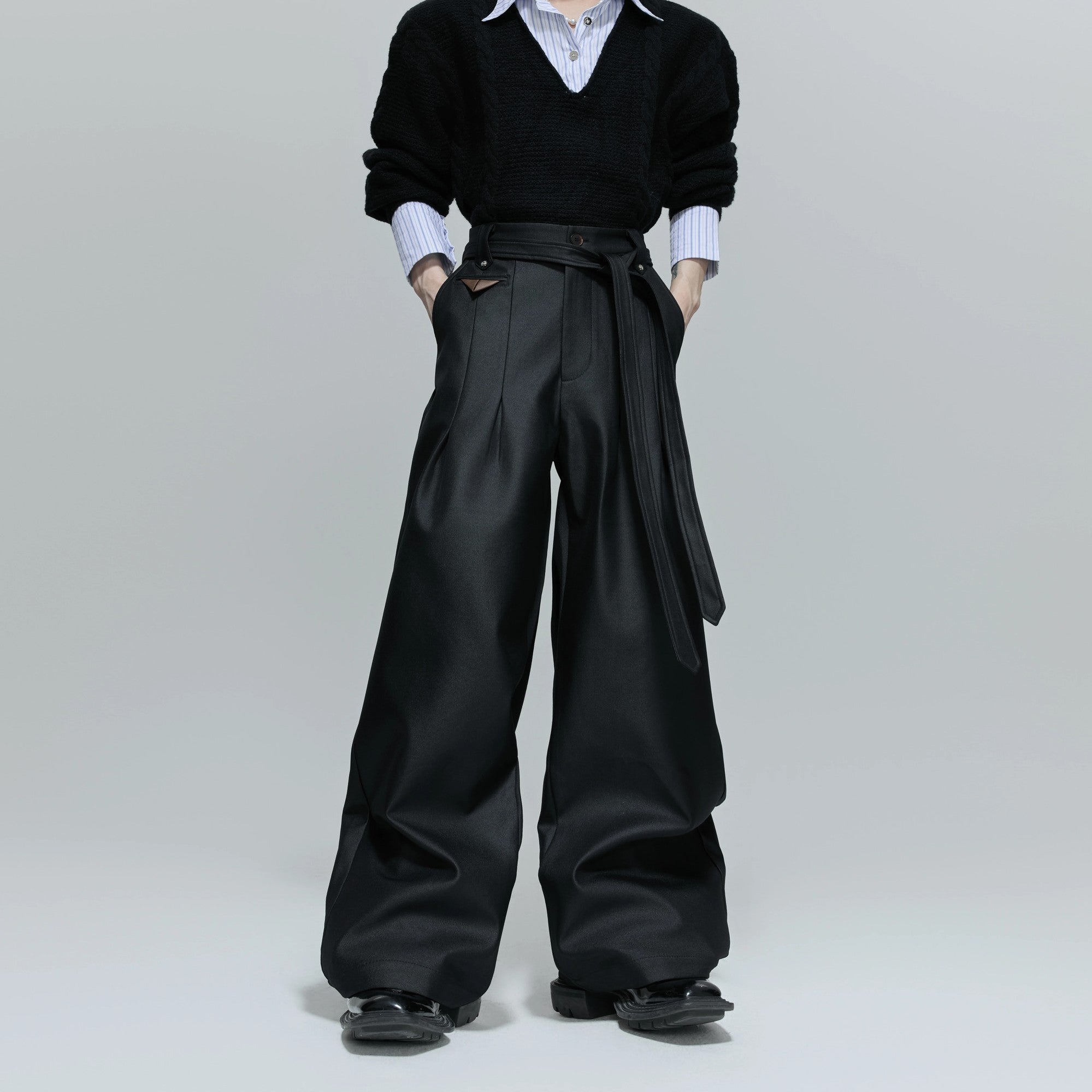 Front view of glossy pleated straight-leg trousers in gray