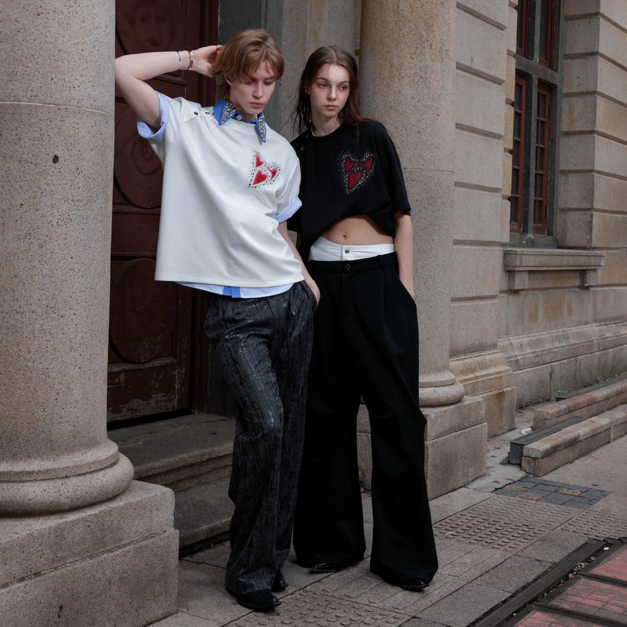 Close up of the unique irregular neckline and metal hardware design