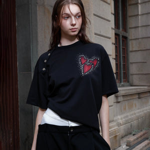 Back view of the black oversized graphic t-shirt showing patchwork details