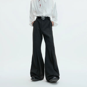 Close-up of matte metal buckle detail on the trouser hem