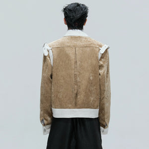 Model wearing the black and white velvet jacket in an urban street setting.