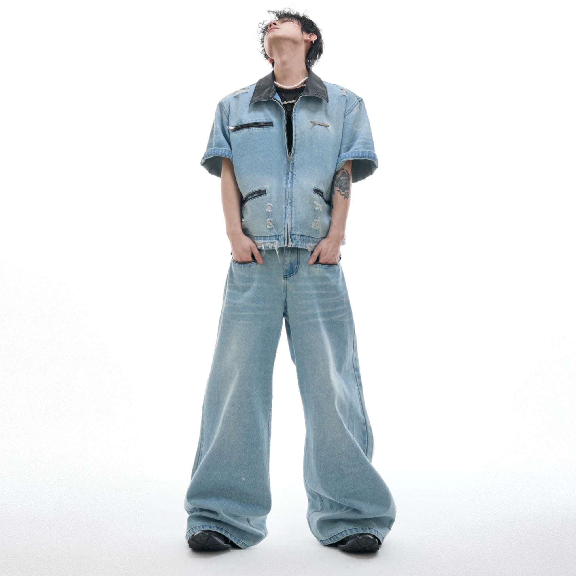 Front view of heavy washed distressed denim jacket with leather collar