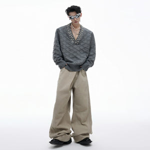 Back view of a black argyle knit sweater showing premium fabric texture