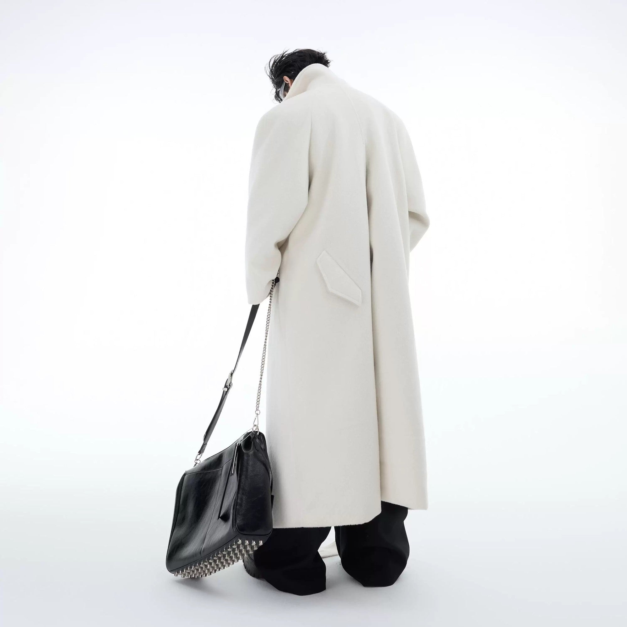 Detailed back view showing the unique slit design of the long wool coat