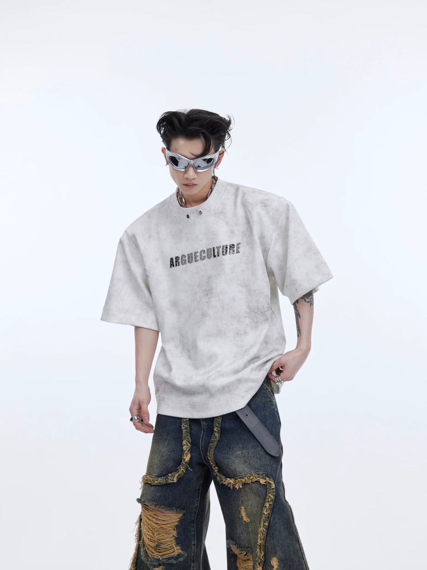 Black heavyweight shimmer t-shirt with padded shoulders and metal accents