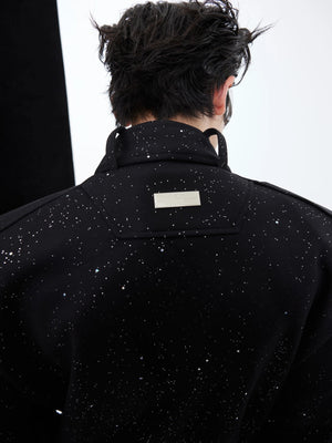 Model wearing the full gray deconstructed tracksuit in an urban setting