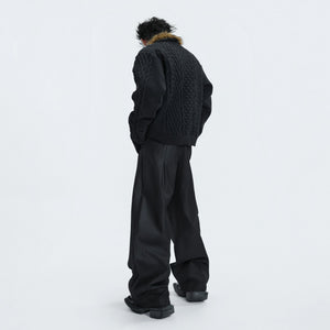 Close-up of pearl and metal button details on the knit cardigan