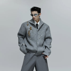 Model wearing the gray relaxed fit sequin sweater in a street setting