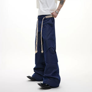 Front view of high waist deconstructed straight leg streetwear pants in gray