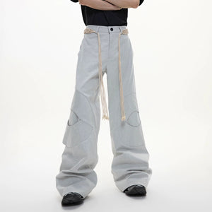 Close up of the circular cut-out design and drawstring waist detail