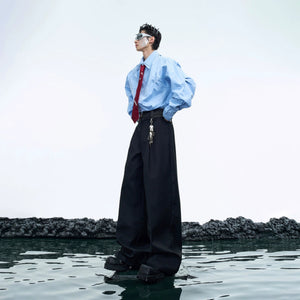 Model wearing black deconstructed flare pants with streetwear aesthetic