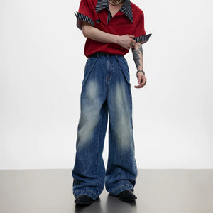 Front view of men's wide-leg jeans with blue floral embroidery