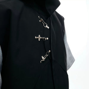 Flat lay of the black and white hooded vest and pants set