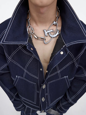 Close-up of the distressed titanium steel chain texture and lock buckle.