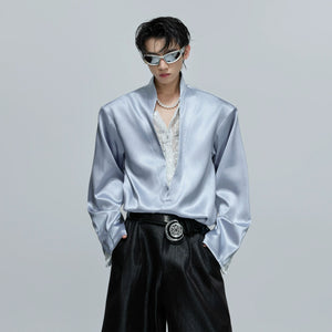 Close-up of the lace and sequin details on a satin streetwear top