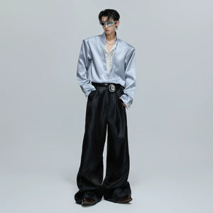 Back view of the loose fit cropped satin shirt showing the silhouette