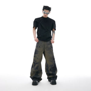 Model wearing laser engraved baggy jeans in a city street setting