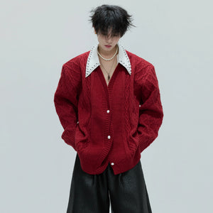 Front view of a luxurious layered wool cardigan with pearl trim collar.