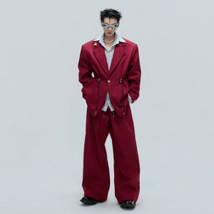 Close-up of the adjustable metal drawstring hardware on a wool blend blazer.