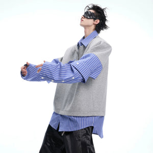 Close up of white layered striped shirt fabric and deconstructed hem