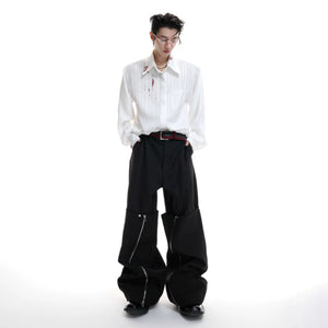 Male model wearing loose fit striped shirt with baggy jeans outfit