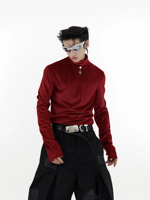 Close up of the metal pendant and liquid fabric texture on a slim fit top.