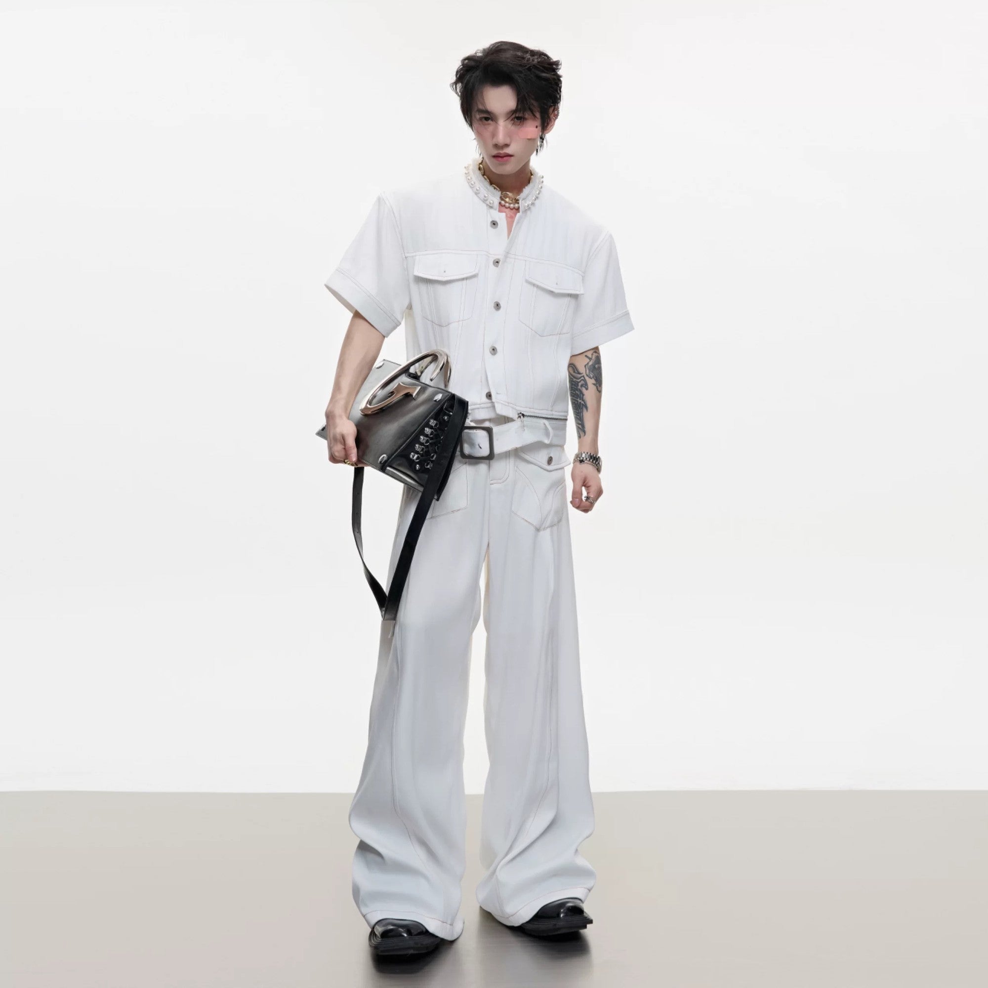 Black deconstructed denim set showing back detail and fit