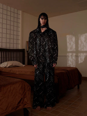 Detail shot of smooth, breathable ice silk fabric in black.