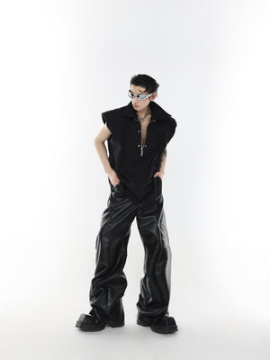 Detailed shot of dimensional pleating and texture on rebellious sleeveless shirt with contemporary tailoring