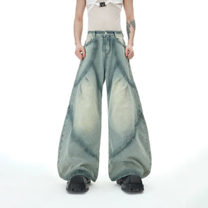 Back view highlighting the unique abstract spray-dye patterns on this distressed vintage denim outfit