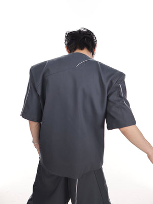 Back view of the fashion-forward blazer set highlighting its unique silhouette and short sleeves