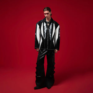 Art punk rock inspired shirt jacket with removable shoulder pads for customizable avant-garde fashion statement