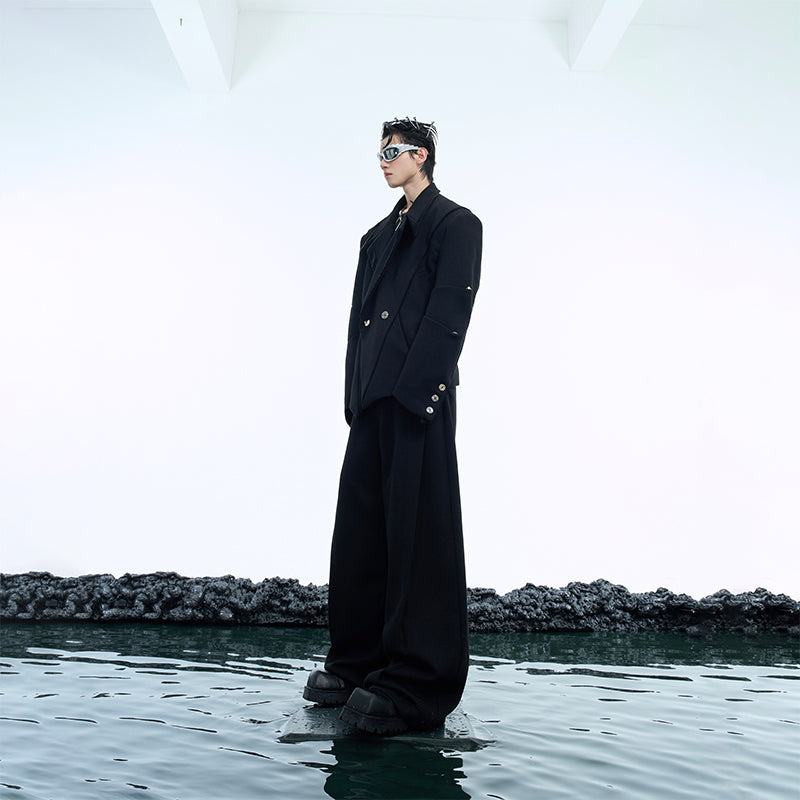 Side angle showing the unique deconstructed silhouette and oversized fit of this fashion-forward blazer