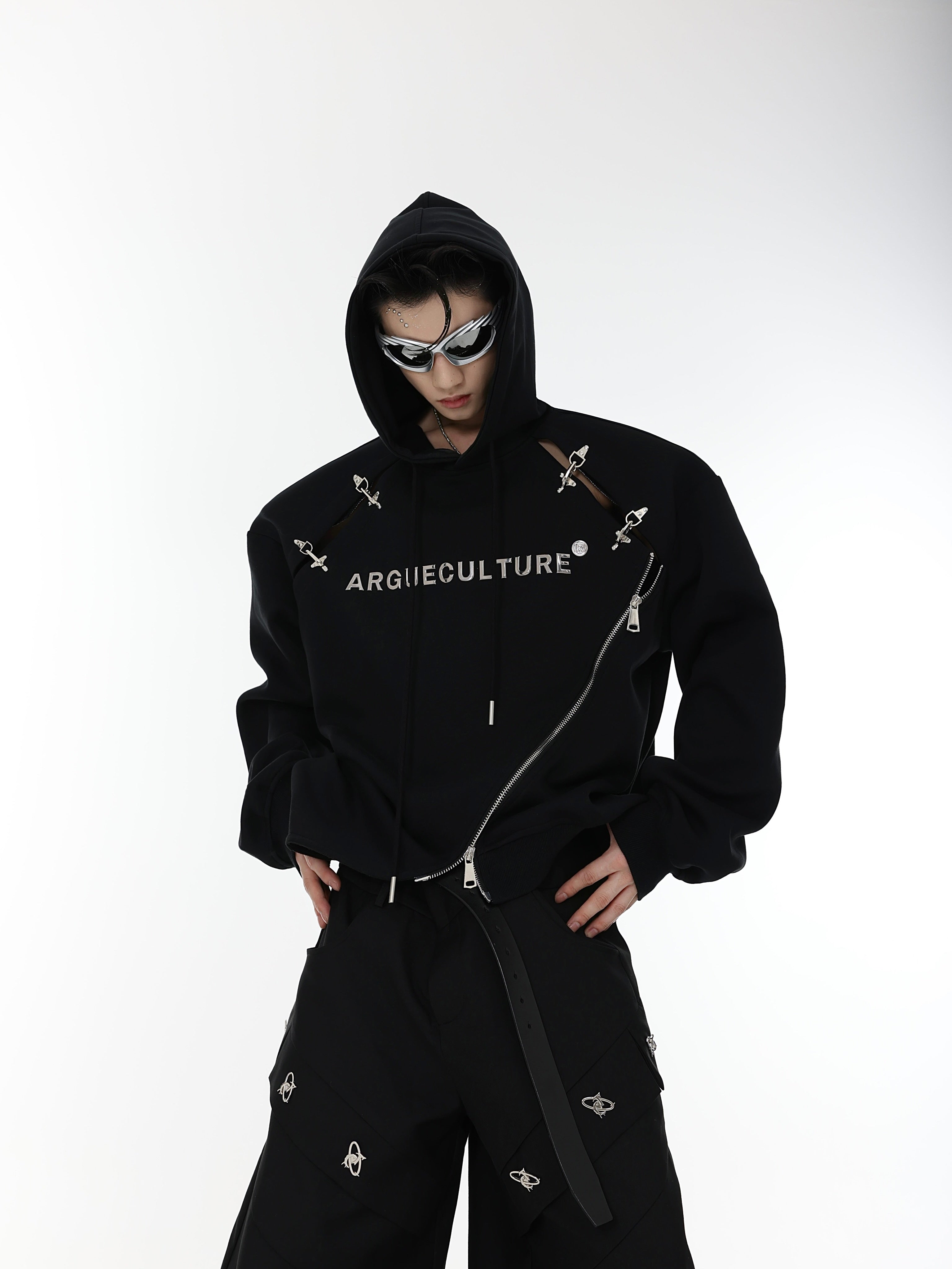 Side angle showing unique airplane buckle details on this deconstructed long sleeve streetwear hoodie