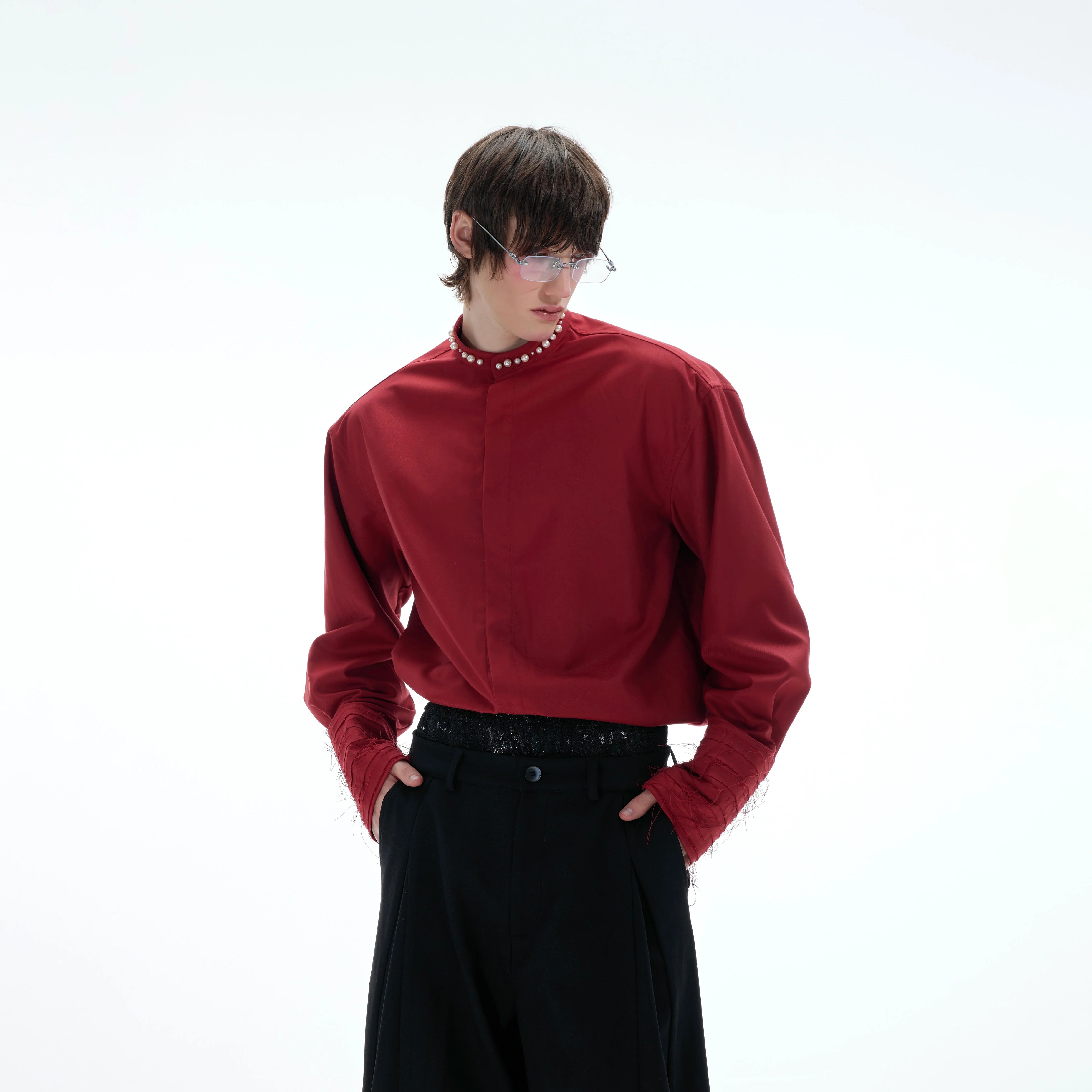 Front view of baroque pearl embellished blouse with puff sleeves, showing round neck and loose fit design