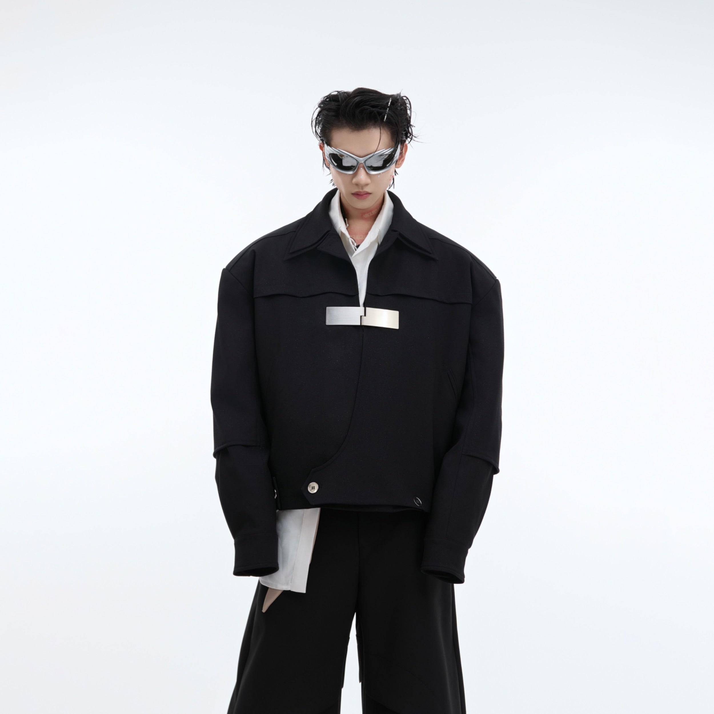 Front view of black oversized streetwear jacket with double collar and metal buckle detailing
