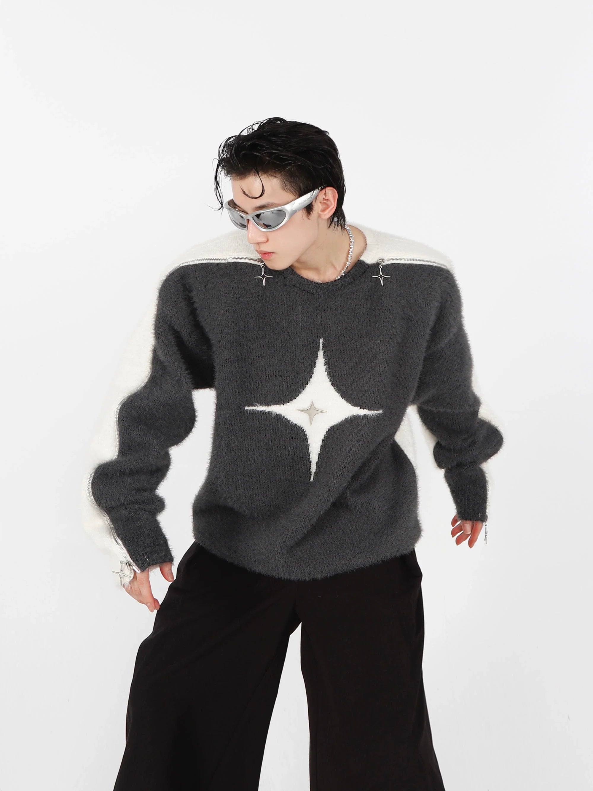 Black and white mohair sweater with metal zip closure, showcasing avant-garde streetwear design