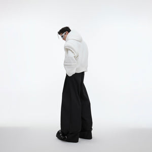 Back view of the avant-garde oversized hoodie showcasing its unique paneling and breathable fabric