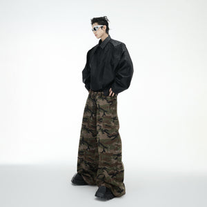 Front view of urban camo cargo jeans featuring a wide-leg silhouette and multiple functional pockets
