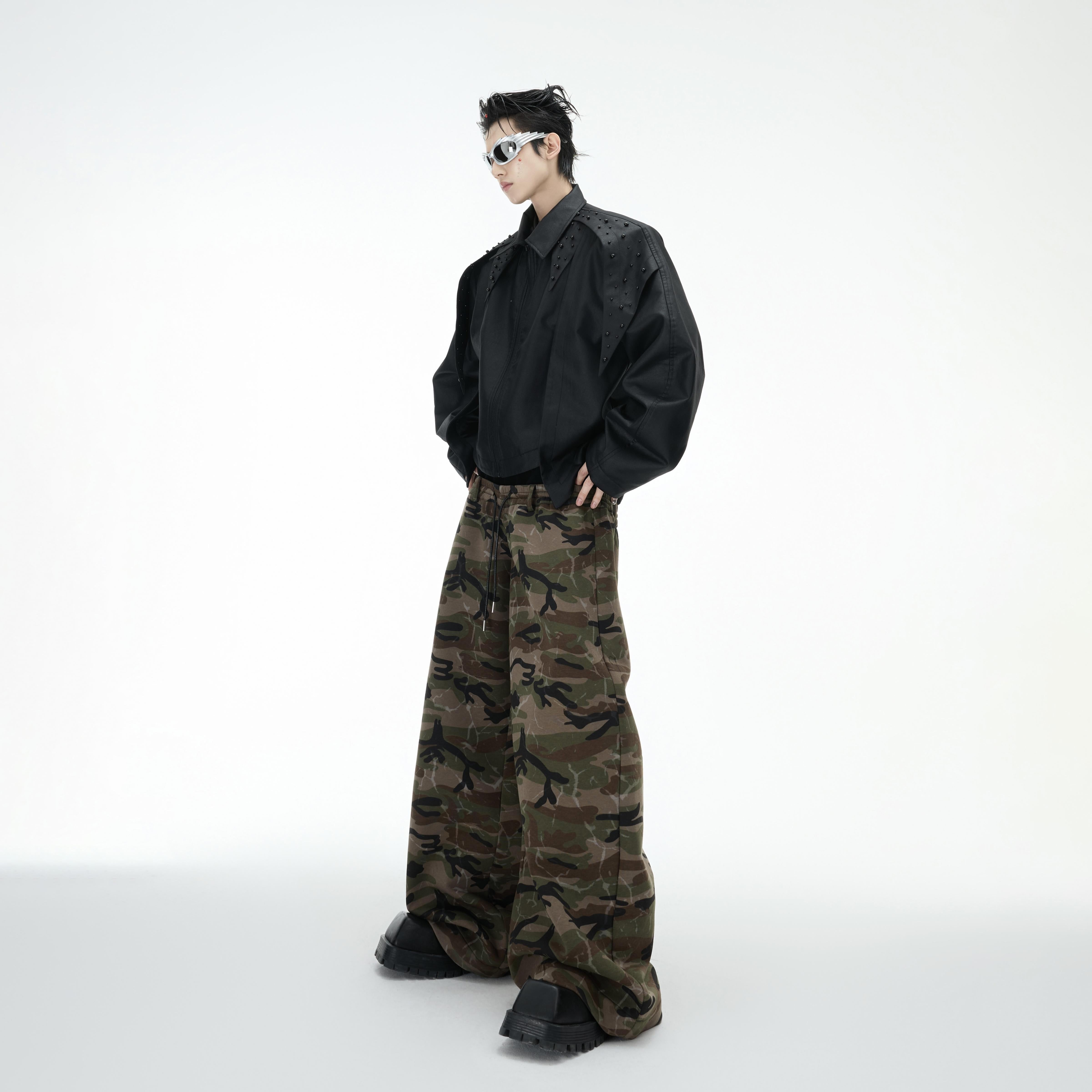 Front view of urban camo cargo jeans featuring a wide-leg silhouette and multiple functional pockets