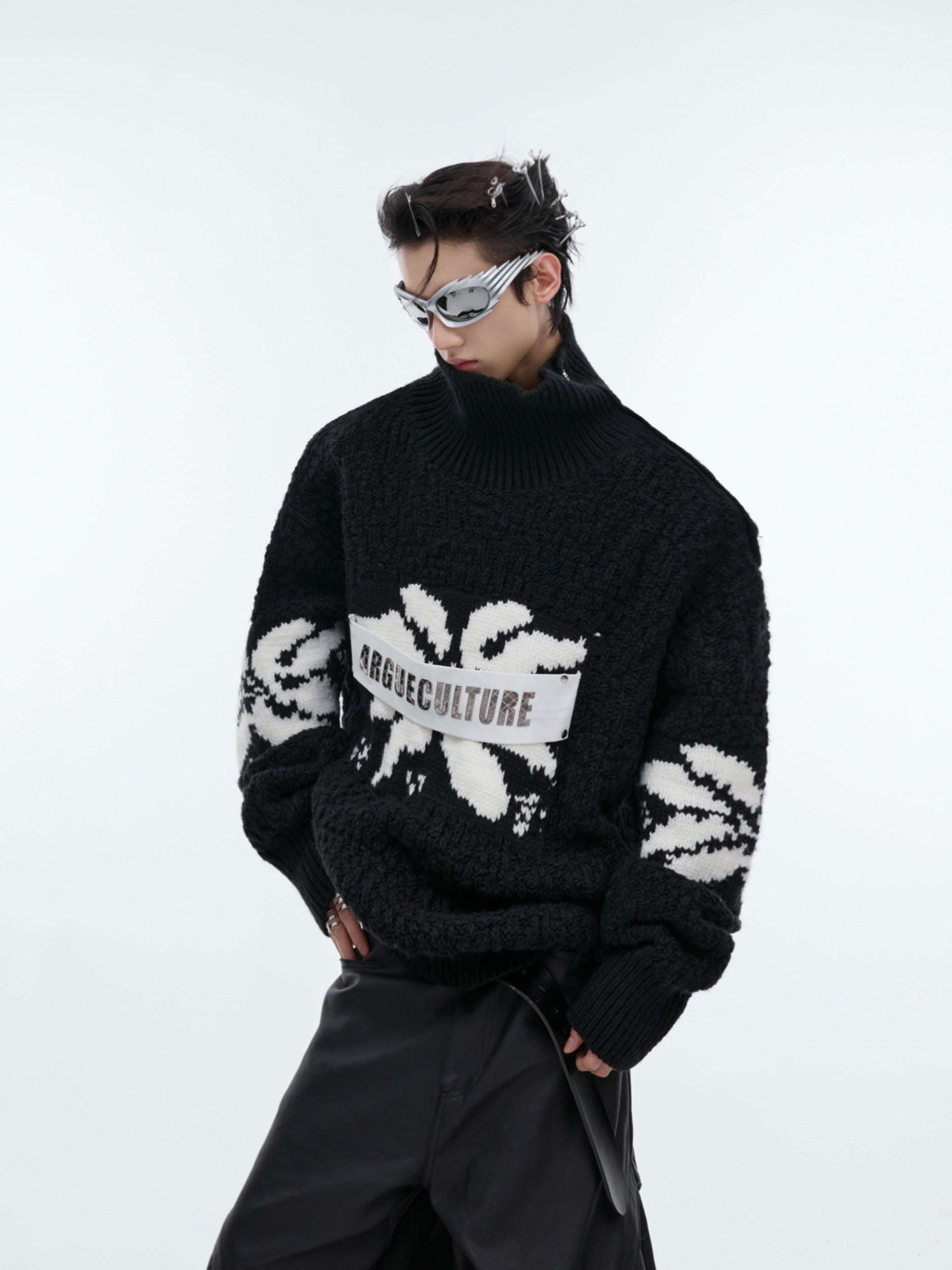 Side angle showing the deconstructed patchwork design and jacquard craftsmanship of this vintage-inspired sweater
