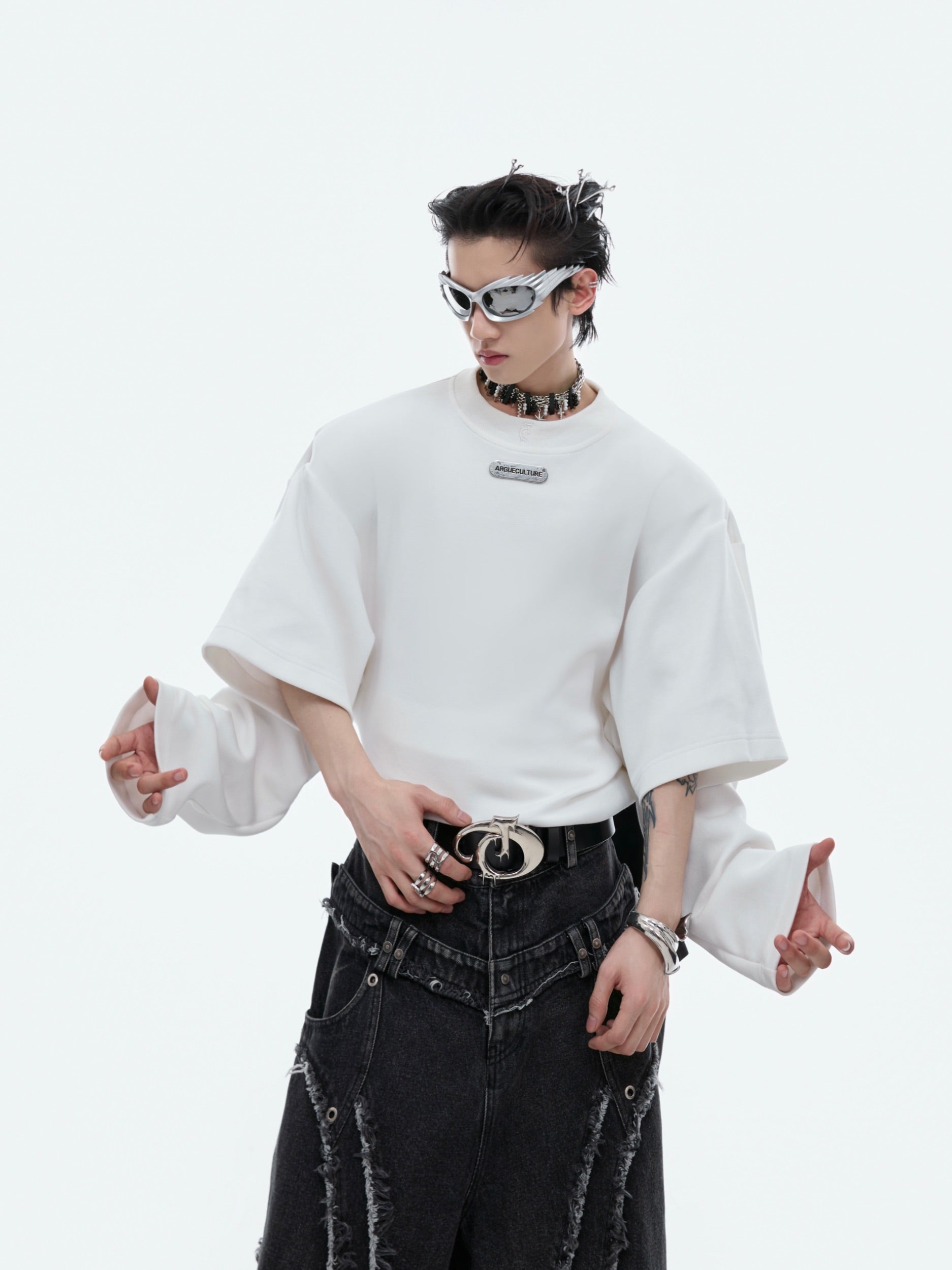 Side angle showing unique color-block design and innovative mock-two-piece construction in this unisex statement hoodie