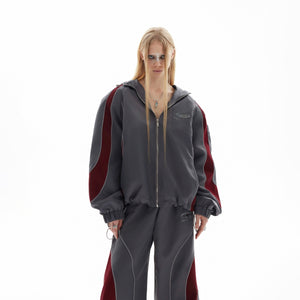 Back view of the reflective color-block windbreaker showing unique silhouette and urban style