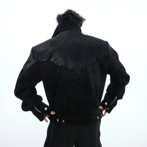 Front view of croc-embossed oversized bomber jacket featuring custom metal studs and logo zipper
