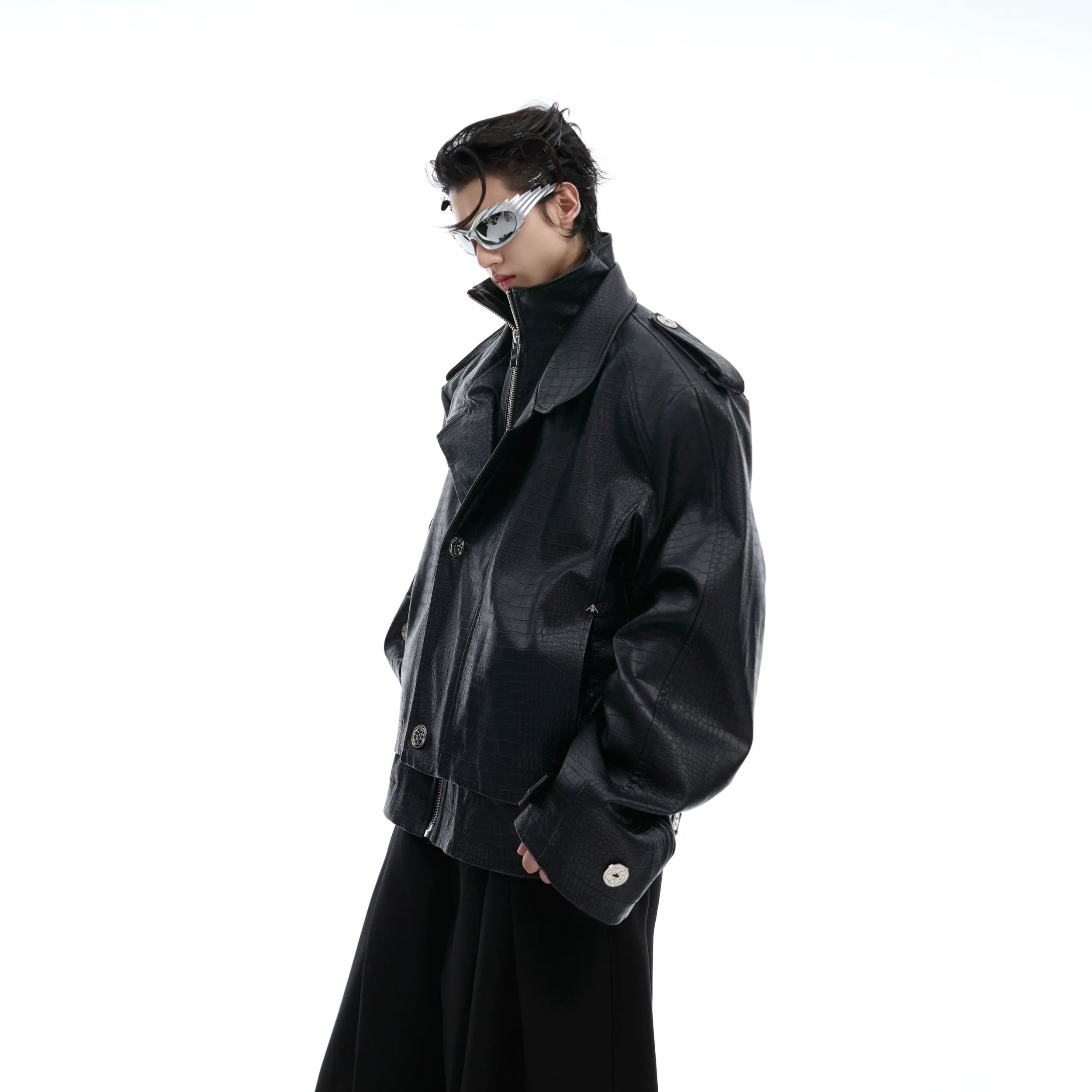 Crocodile print biker jacket with avant-garde deconstructed design, featuring segmented paneling and cropped silhouette