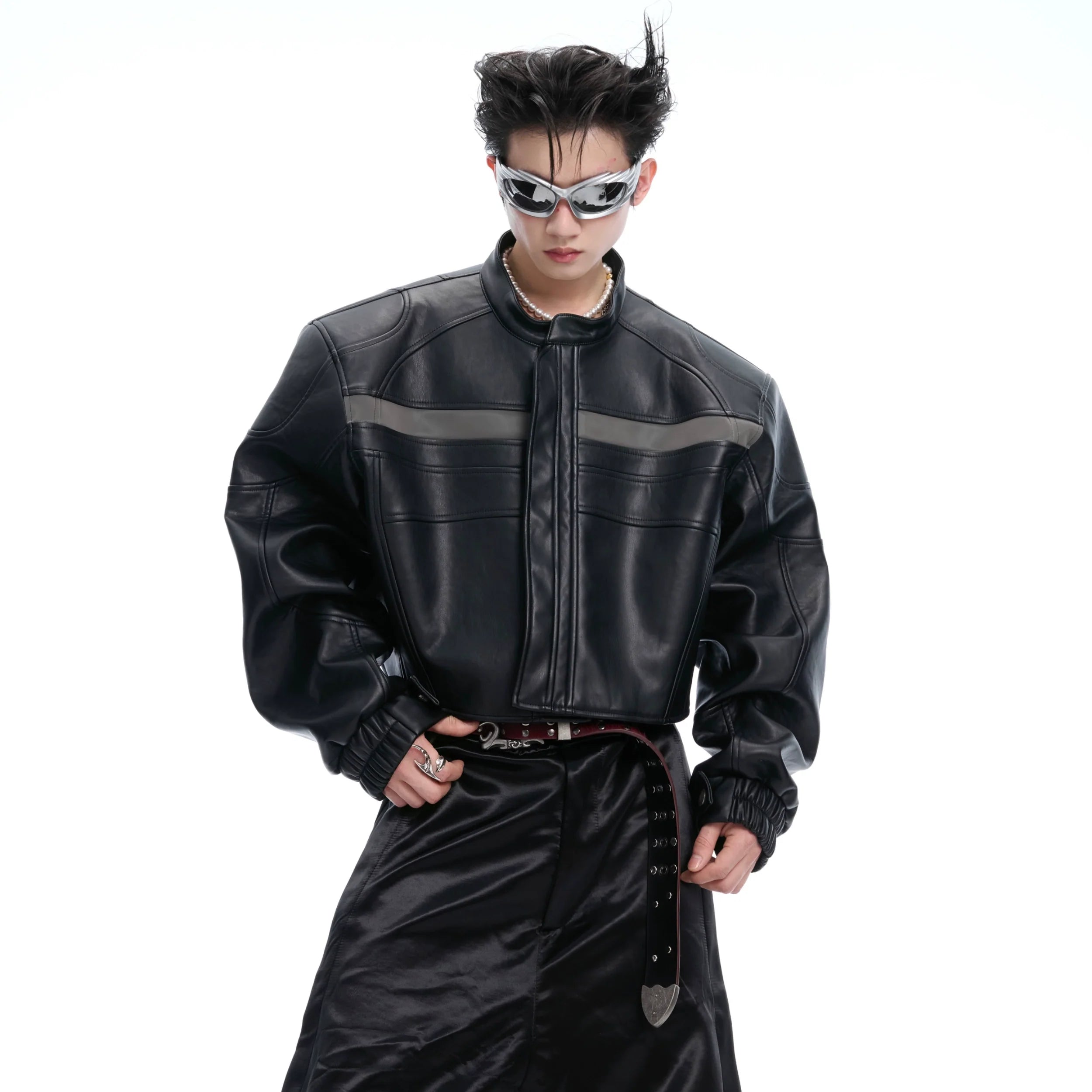 Front view of cropped deconstructed biker jacket with striking contrast stitching, showcasing edgy streetwear style