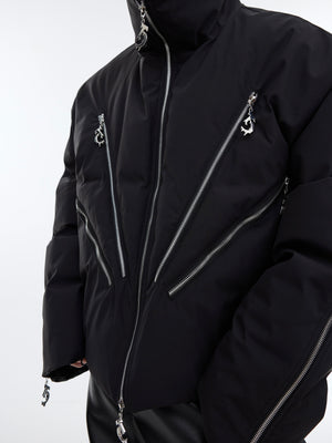 Model wearing heavyweight cropped puffer jacket with signature oversized silhouette and reconstructed panels