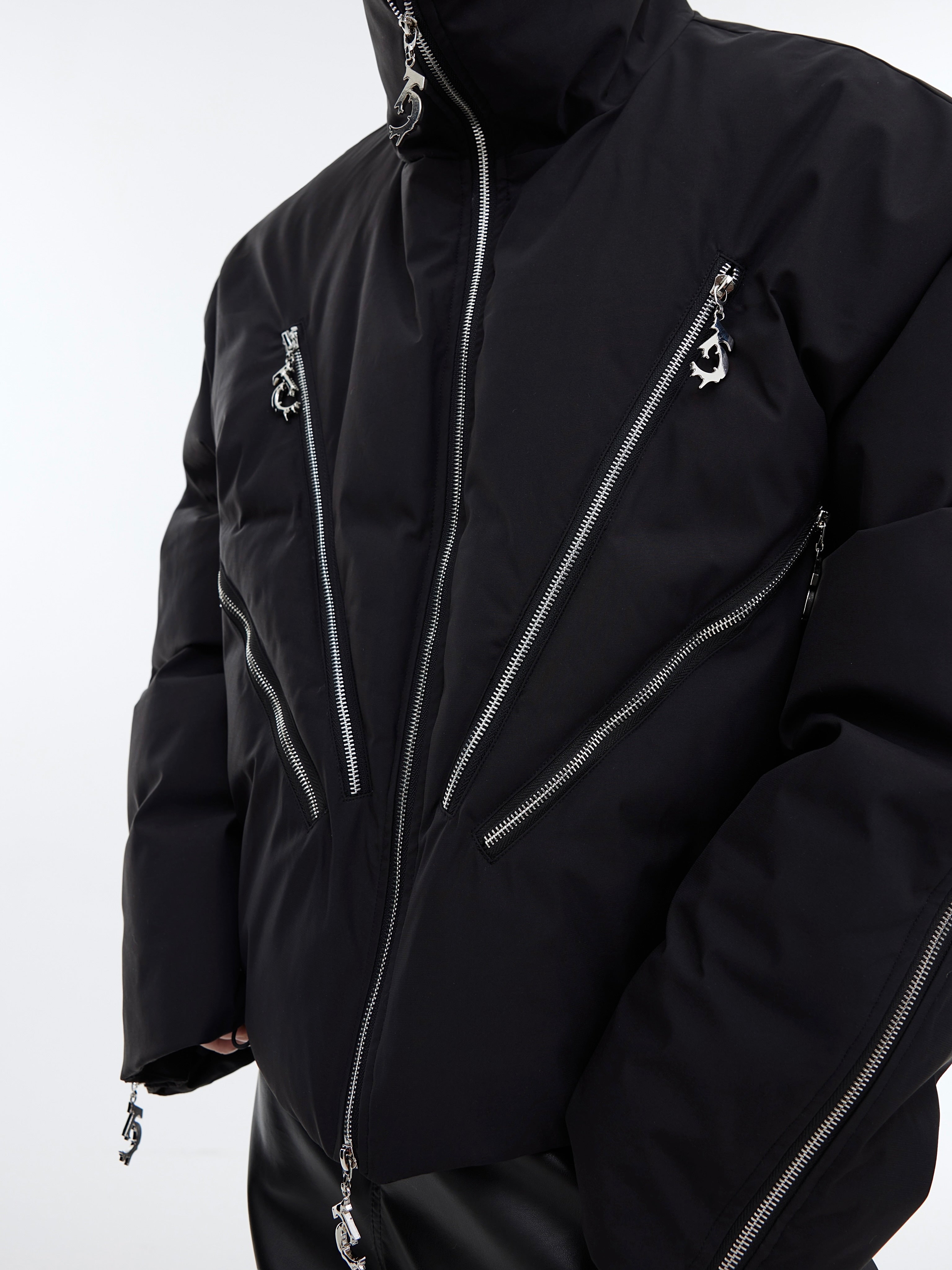 Model wearing heavyweight cropped puffer jacket with signature oversized silhouette and reconstructed panels