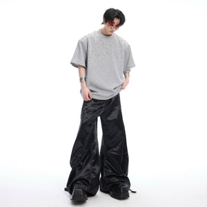 Layflat presentation showing full design of asymmetric crystal-embellished cotton crewneck