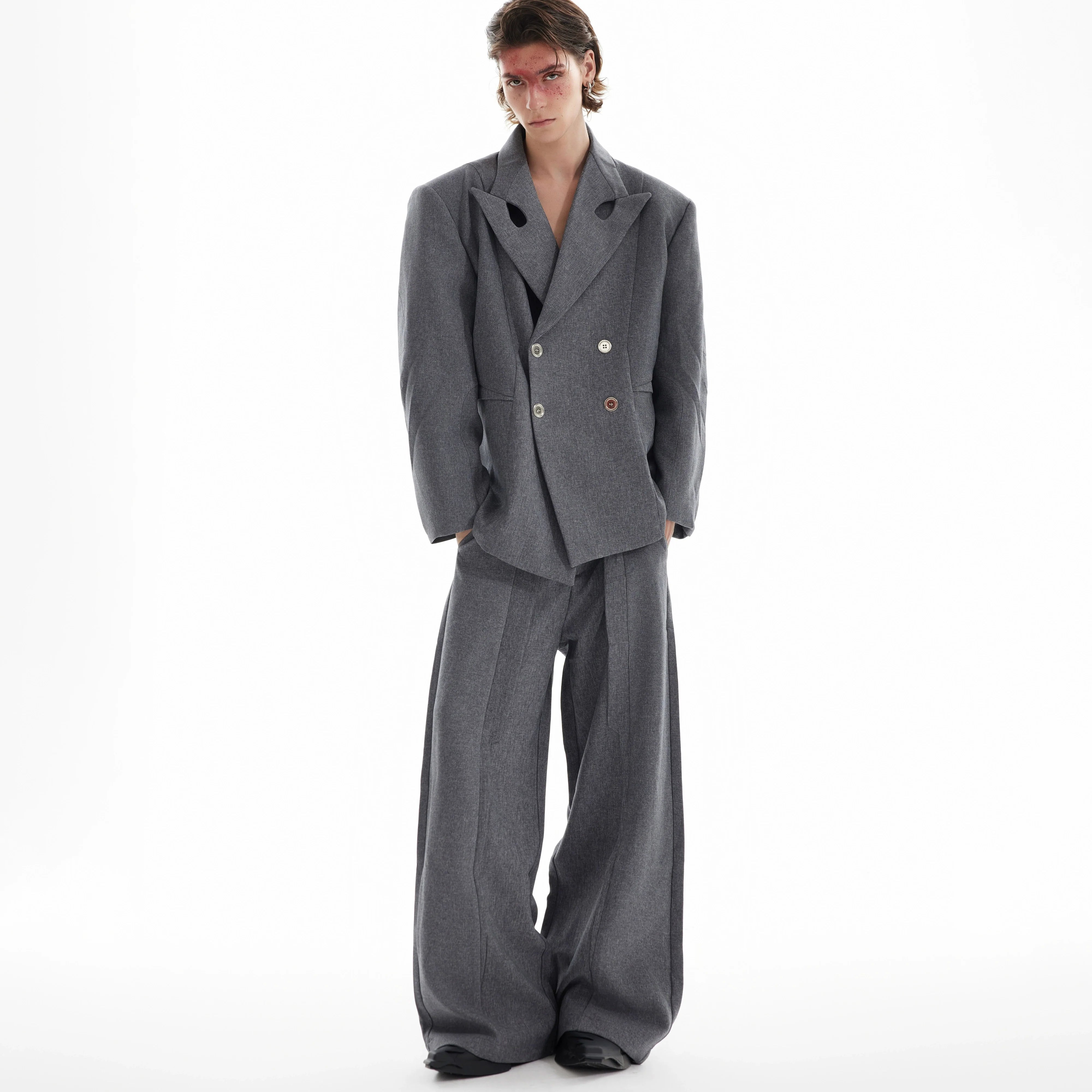 Fashion-forward deconstructed blazer with asymmetrical lapel design, showcasing avant-garde streetwear style